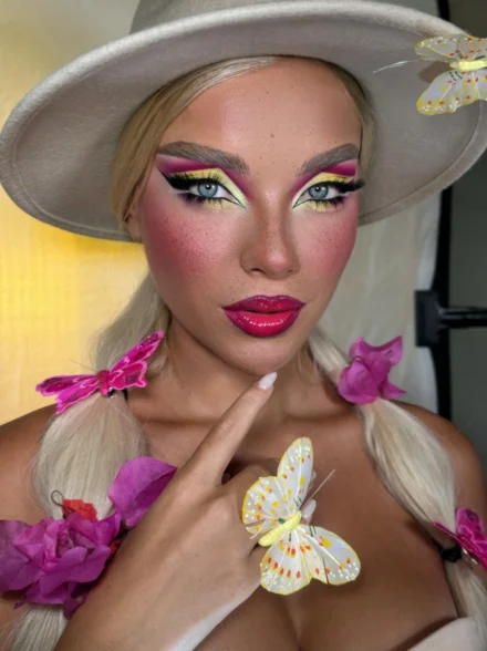 Vibrant pink and yellow eye look with hat by Anna Balantinou