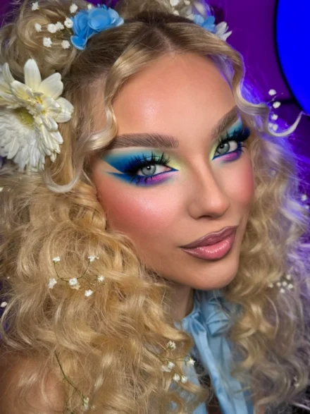 Mermaid-inspired makeup with golden curls and blue eyeshadow by Anna Balantinou